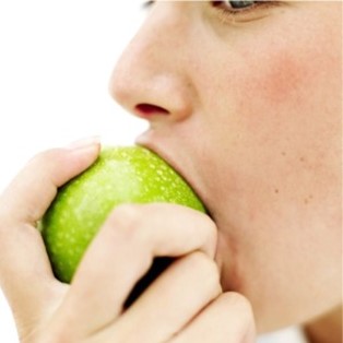 Person eating an apple